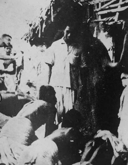 Harijans having a darshan at a small temple open to them by Gandhiji somewhere in the Puri distric.jpg